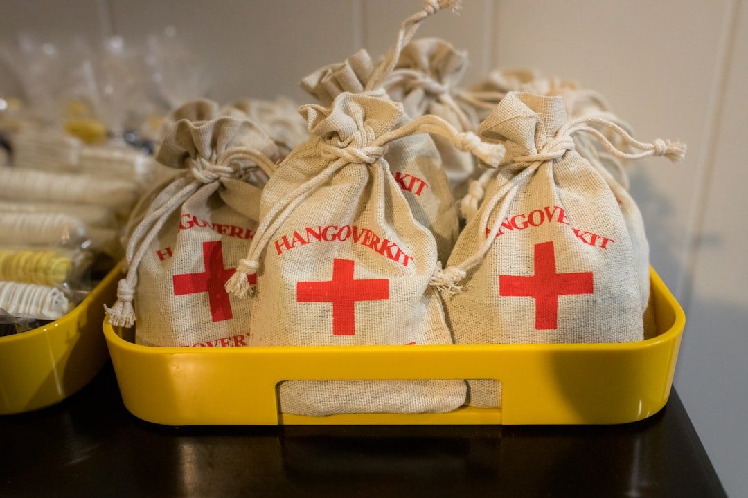 white-and-red-textile-on-yellow-plastic-container-bxannfhes4o